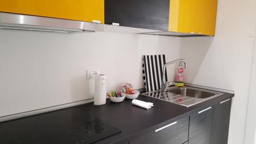 a kitchen with a sink and a counter top at BSuites Apartment in Padova