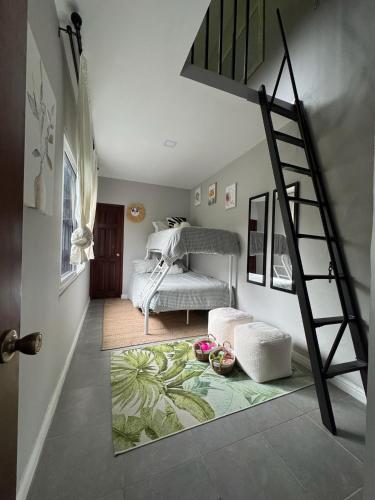 a bedroom with a spiral staircase and a bed at Casa Coco in Valle de Anton