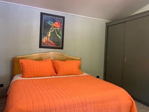 Giường trong phòng chung tại Casa Cocles