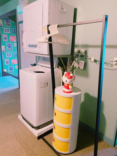 a hospital room with a machine and a stuffed animal at 別海町greenstar in Nishi-shumbetsu