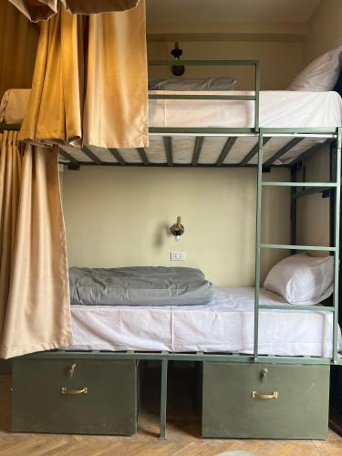 a bunk bed with two bunk beds in a room at Green hostel in Cairo