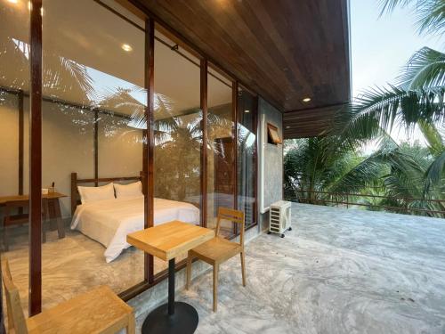 Postel nebo postele na pokoji v ubytování COCO HOME Homestay(โคโค่โฮม)