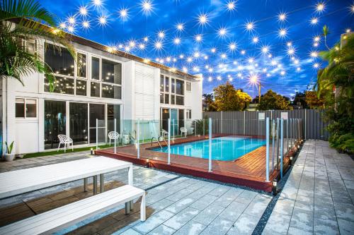 a house with a swimming pool with a star ceiling at City Star Lodge in Brisbane