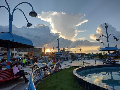 people sitting around a pool on a cruise ship at Hogar y naturaleza in Iquitos