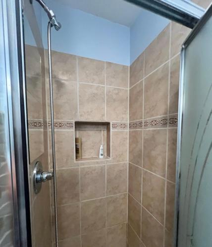 a shower with a glass door in a bathroom at Beaver Creek, Avon condo, walk to ski shuttle - on the Eagle River in Avon
