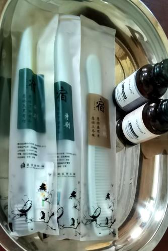 a group of four bottles of mascara in a jar at Dreamer Resort in San Vicente