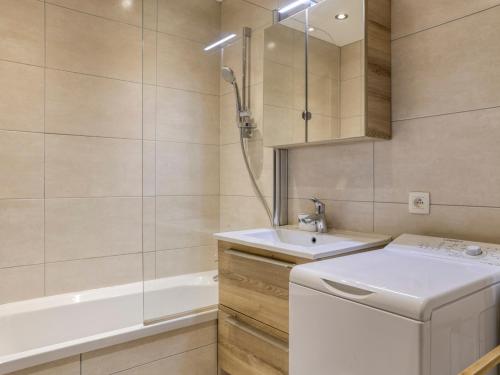 a bathroom with a sink and a washing machine at Studio cabine à Megève pour 4 pers, avec balcon, animaux admis, proche télécabine - FR-1-453-323 in Megève