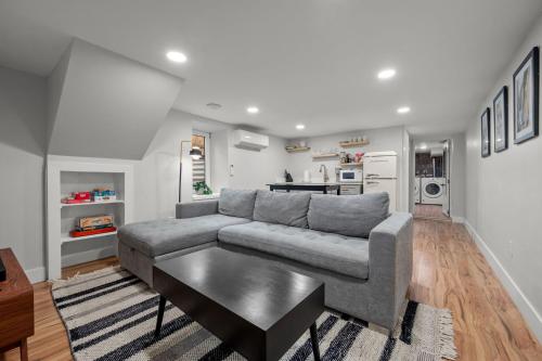 a living room with a couch and a table at Downtown Stay off Broadway Nightlife Nearby Parking in Denver