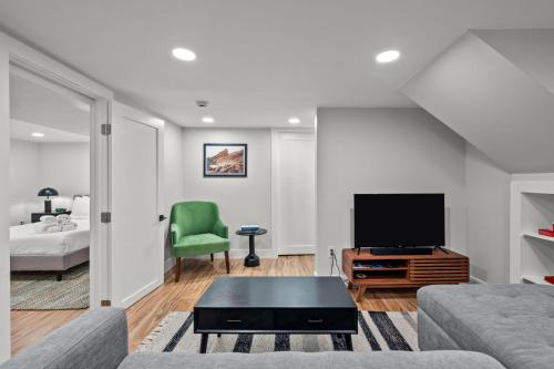 a living room with a couch and a television at Downtown Stay off Broadway Nightlife Nearby Parking in Denver
