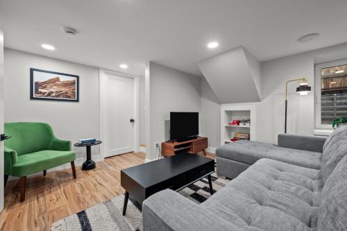 a living room with a couch and a chair at Downtown Stay off Broadway Nightlife Nearby Parking in Denver