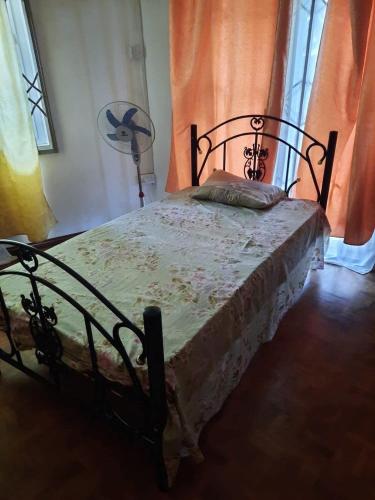 a bedroom with a bed in a room at NR appartments in Curepipe
