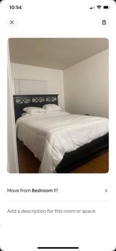 a bedroom with a bed with a white bedspread at Sofi Intuit Forum Vacation Oasis in Los Angeles