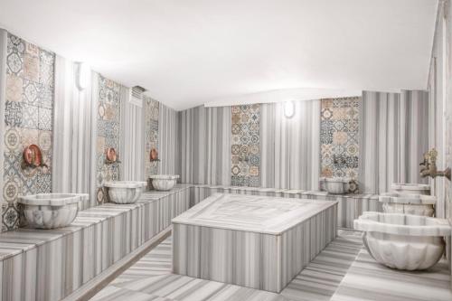 un rendering di un bagno con lavandini e specchi di Ladik Hotel a Karahayit