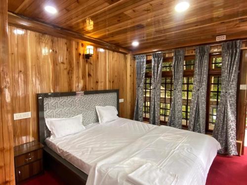 Katil atau katil-katil dalam bilik di Magnolia Farmhouse and Homestay
