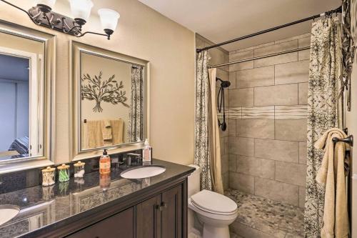 a bathroom with a toilet and a sink and a shower at NEW Pool Spa Firepit Pool Table Sleeps 12 in Lake Havasu City