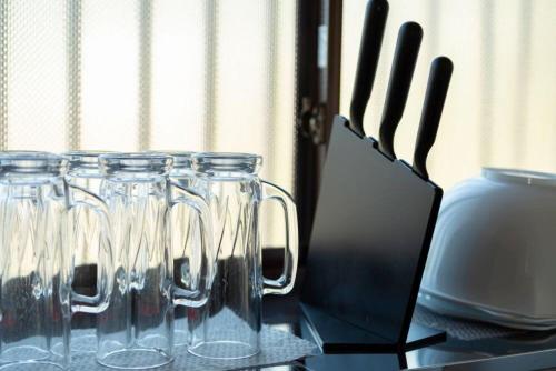 a group of wine glasses sitting on a table at Viva Sumoto in Amakusa