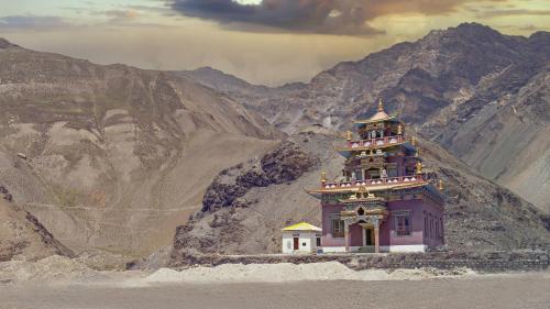 a building in the middle of a mountain at Echor Mud Huts Tabo, Spiti Valley in Kaza