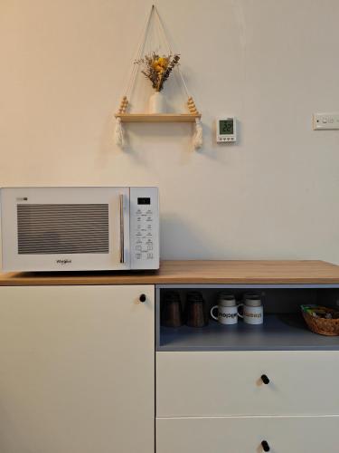 a microwave oven sitting on top of a counter at Humble Abode near Ringwood in Heathmont