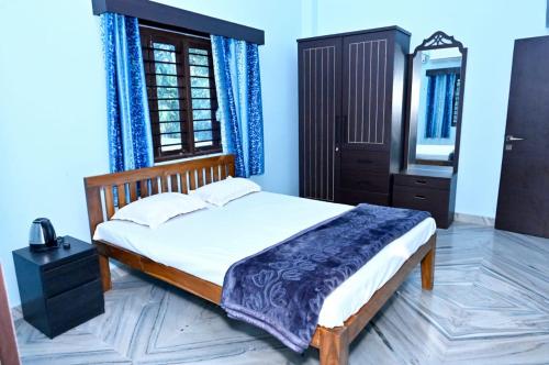 Postel nebo postele na pokoji v ubytování Sneh Beach Homestay - Wayangani Vengurla