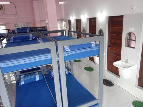 Postel nebo postele na pokoji v ubytování ASHRAMAM HEALTH RESORT