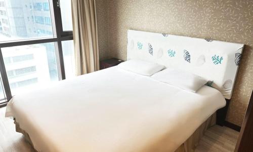 Postel nebo postele na pokoji v ubytování Centum City Hotel