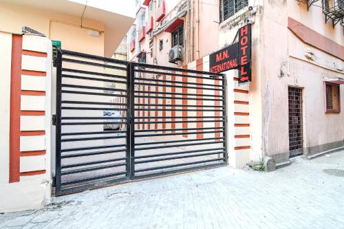 a black gate in front of a building at FabHotel MN International - Nr Park Circus in Kolkata
