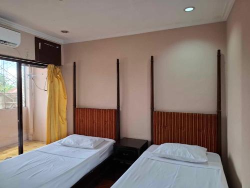 Postel nebo postele na pokoji v ubytování DDD Habitat, Inc - Cagayan De Oro