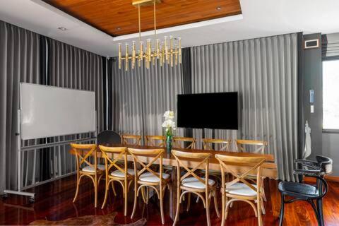 a dining room with a table and chairs at The Height Khaoyai Resort in Ban Huai Sok Noi