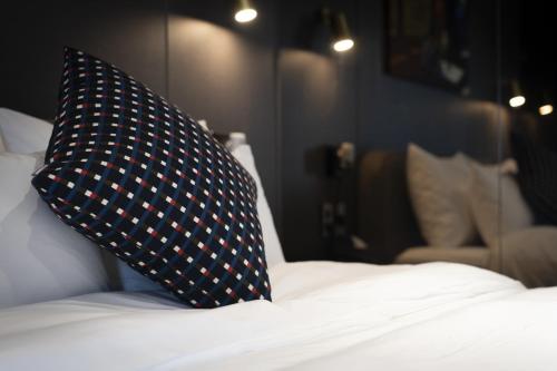 Ένα ή περισσότερα κρεβάτια σε δωμάτιο στο Goyo37 Hotel Osan by Aank