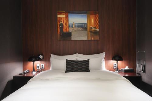 Ένα ή περισσότερα κρεβάτια σε δωμάτιο στο Goyo37 Hotel Osan by Aank