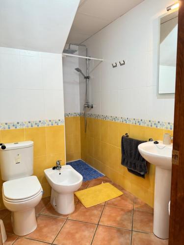 a bathroom with a toilet and a sink at House Lago Azul in Cuevas del Almanzora