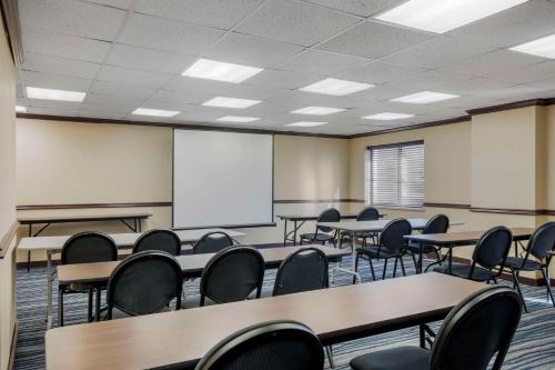 a classroom with tables and chairs and a whiteboard at Comfort Inn & Suites Brentwood - Nashville in Brentwood