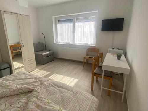 Postel nebo postele na pokoji v ubytování Omni Residence Vendégház