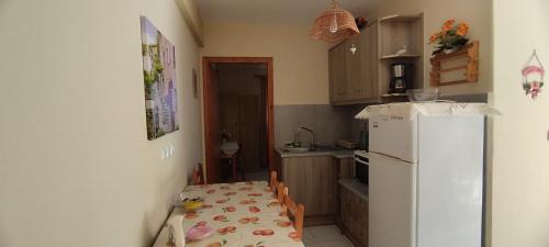 Η κουζίνα ή μικρή κουζίνα στο Polymnia Apartments