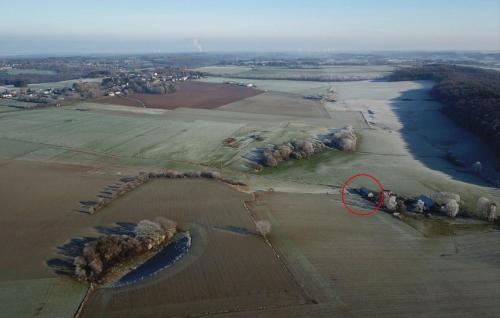 an aerial view of a field with a red circle at Gite de Baive in Assesse