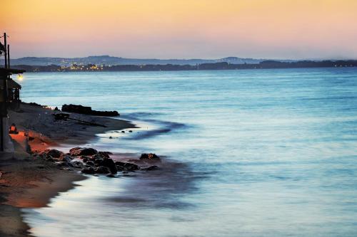 a view of the ocean at sunset at Olympos Beach in Plaka Litochorou