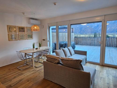a living room with a couch and a table at Sunny AP22 in Bovec
