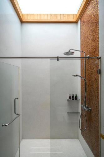 a shower with a glass door in a bathroom at The Height Khaoyai Resort in Ban Huai Sok Noi
