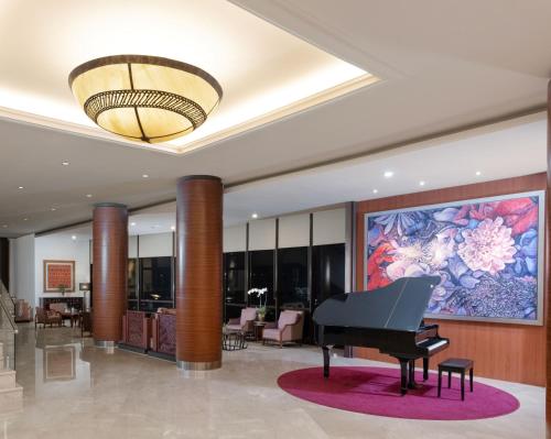a piano in the lobby of a hotel at Santika Premiere Bintaro in Serpong
