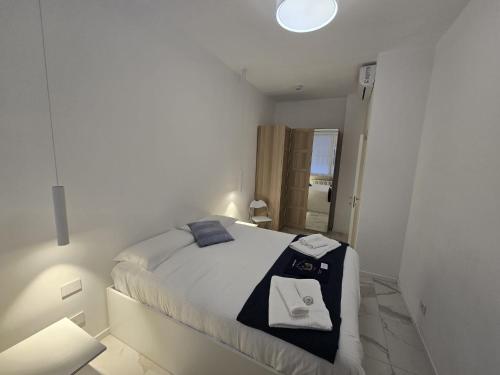 A bed or beds in a room at Appartamenti Reali Bonaccini