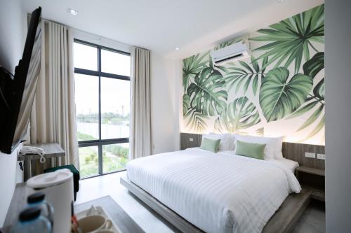 Tree Airport Hotel Hatyaiにあるベッド