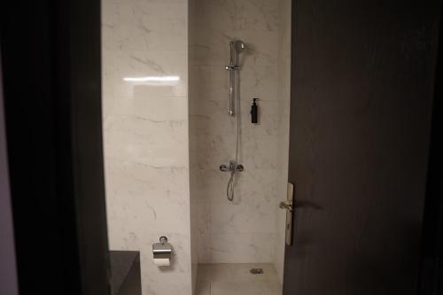 a shower stall in a bathroom with a shower at Ista Vacation Homes Rental LLC in Dubai