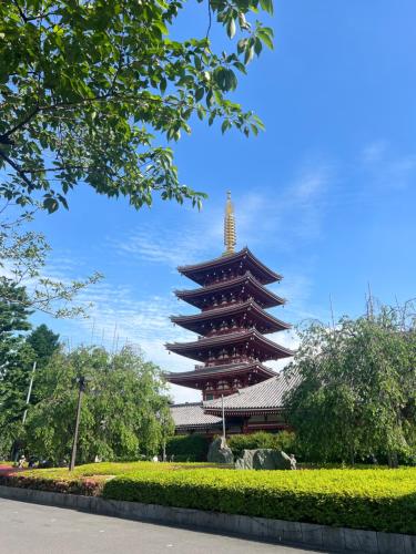 a large building with a tower in a park at T-Hotel 浅草 in Tokyo