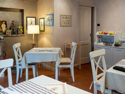 a dining room with a table and chairs at Charming Sirmione in Sirmione