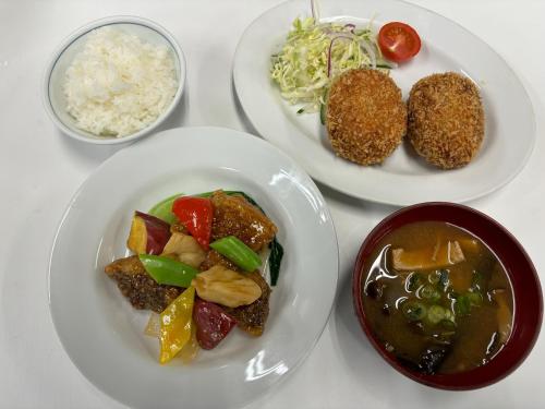 three plates of food on a table with rice at 美咲旅館 in Sakaide