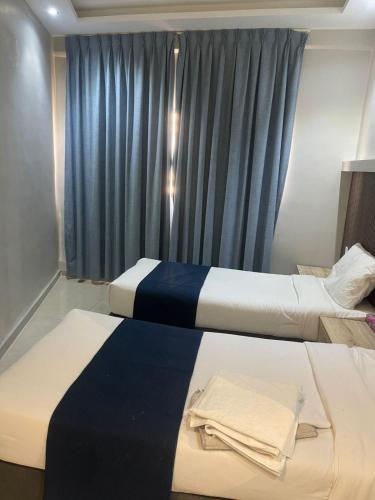 Ένα ή περισσότερα κρεβάτια σε δωμάτιο στο Alraha VIP Marsa zayed Aqaba