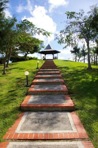 a pathway leading to a gazebo in a park at PIERRE & VACANCES Margarita 35 in Sainte-Luce