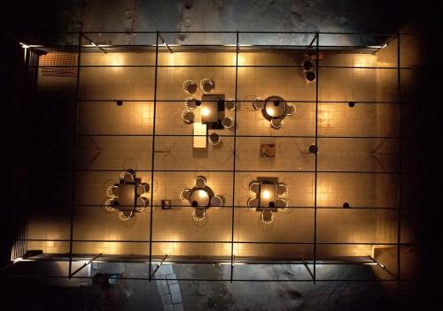 a wall with lights on it in a room at Thour Nature Resort - Jawai Leopard Safari Camp in Bera