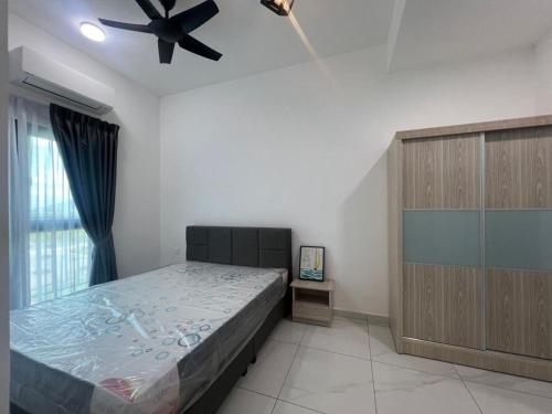 Ένα ή περισσότερα κρεβάτια σε δωμάτιο στο Di Aran Residence Penang