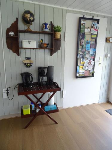 a room with a table in front of a door at B&B Piccardie in Emlichheim